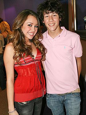 miley_cyrus_admits_dating_nick_jonas_main_2998[1].jpg